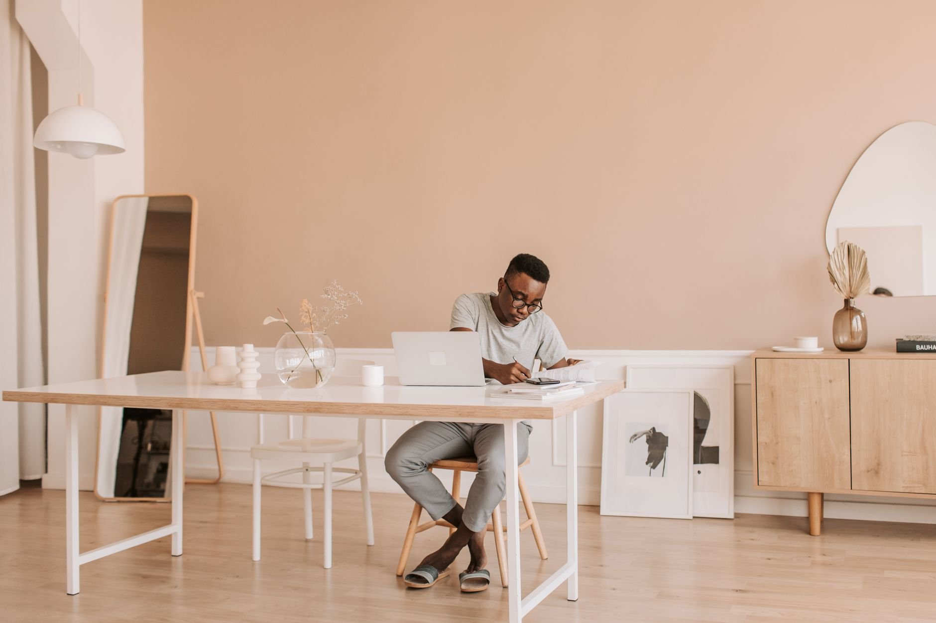Man working on a laptop at a modern home office